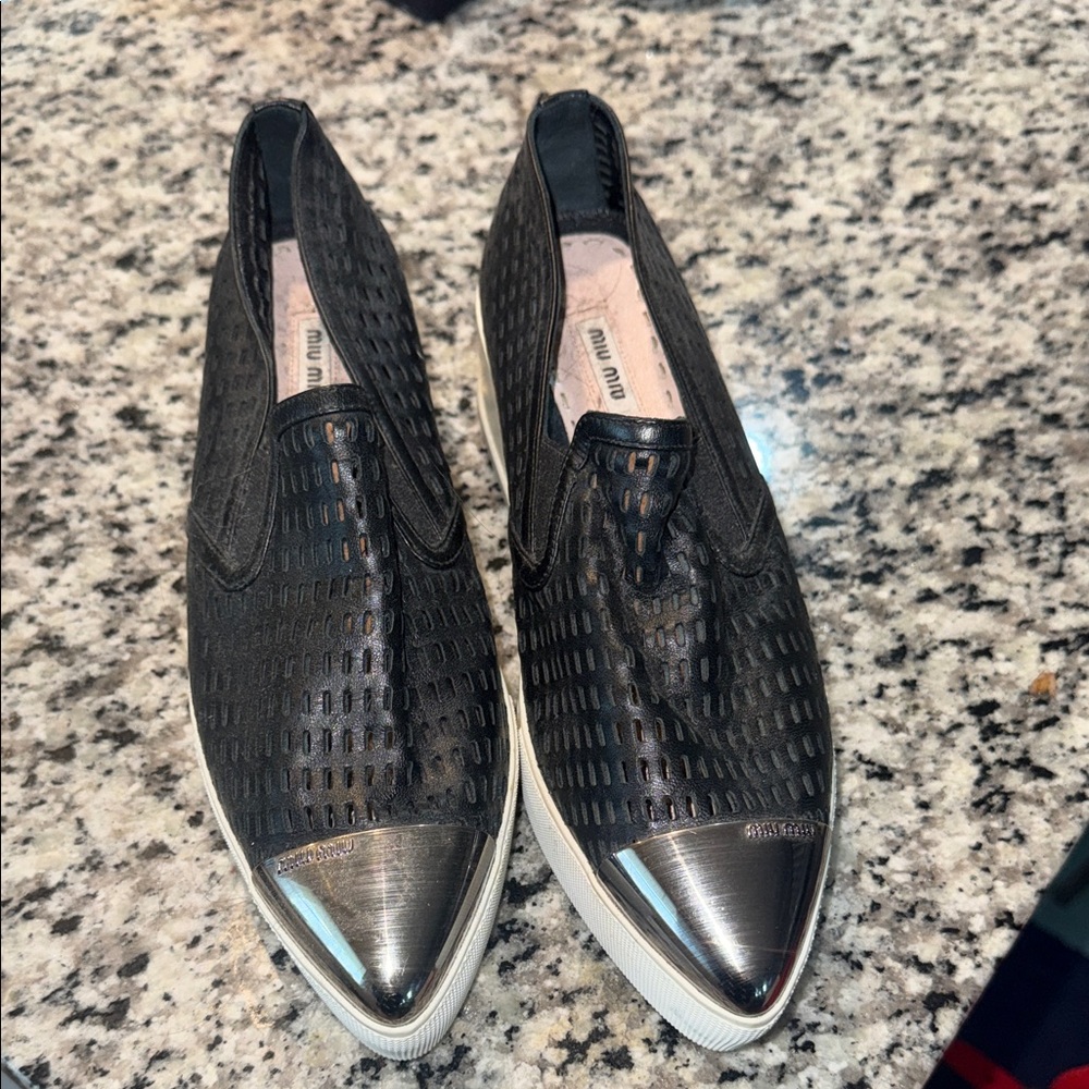 Miu Miu Black Perforated Leather Slip-On Sneakers with Silver Metallic Toe